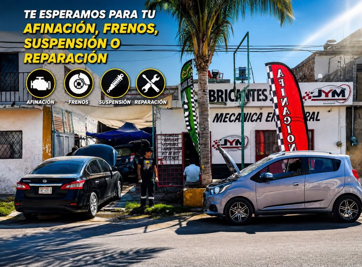 Fachada del taller y vehículos en servicio, con la rotulación anterior JYM